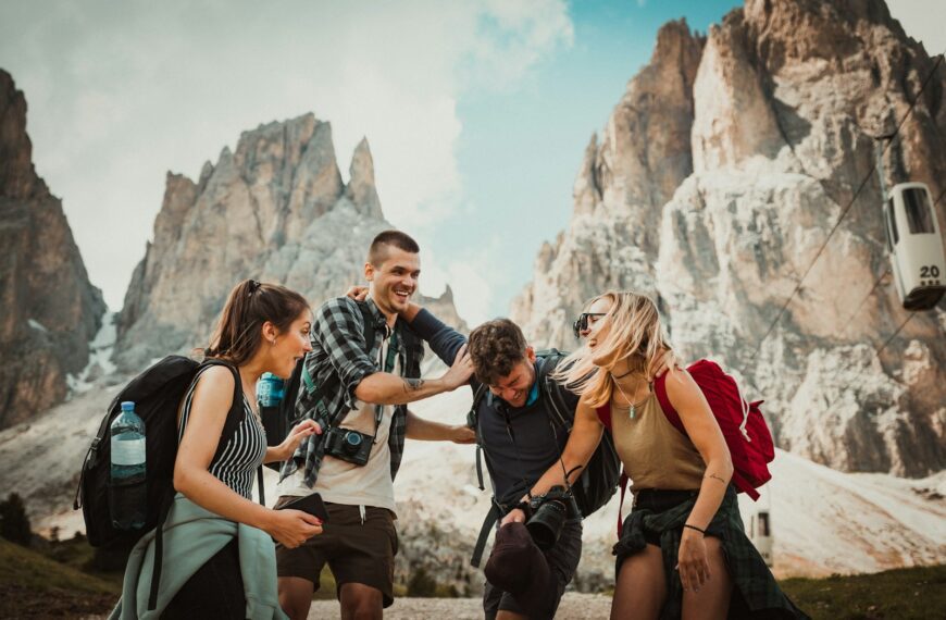 low-angle photography of two men playing beside two women