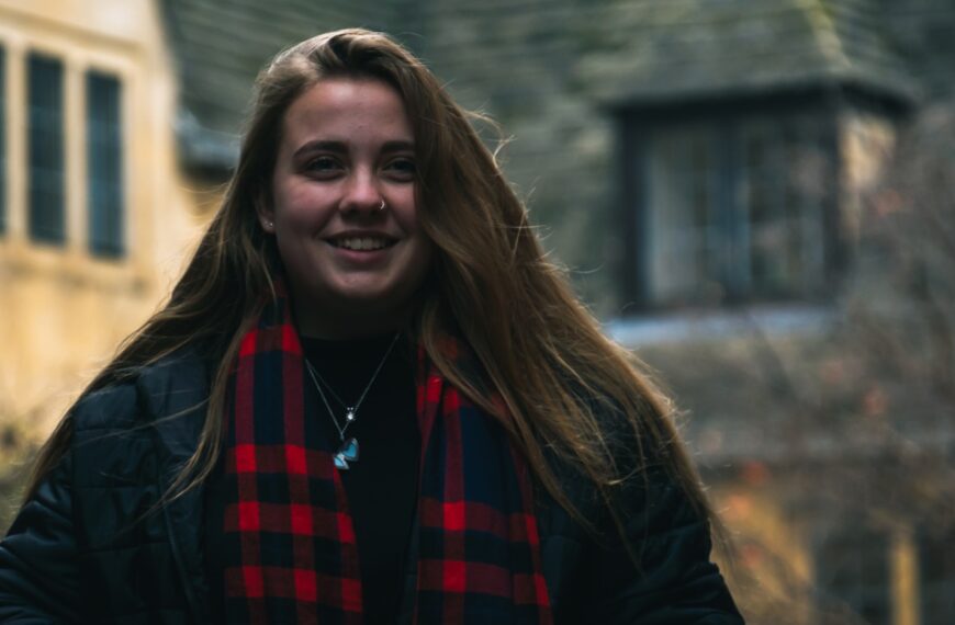 woman in black jacket smiling
