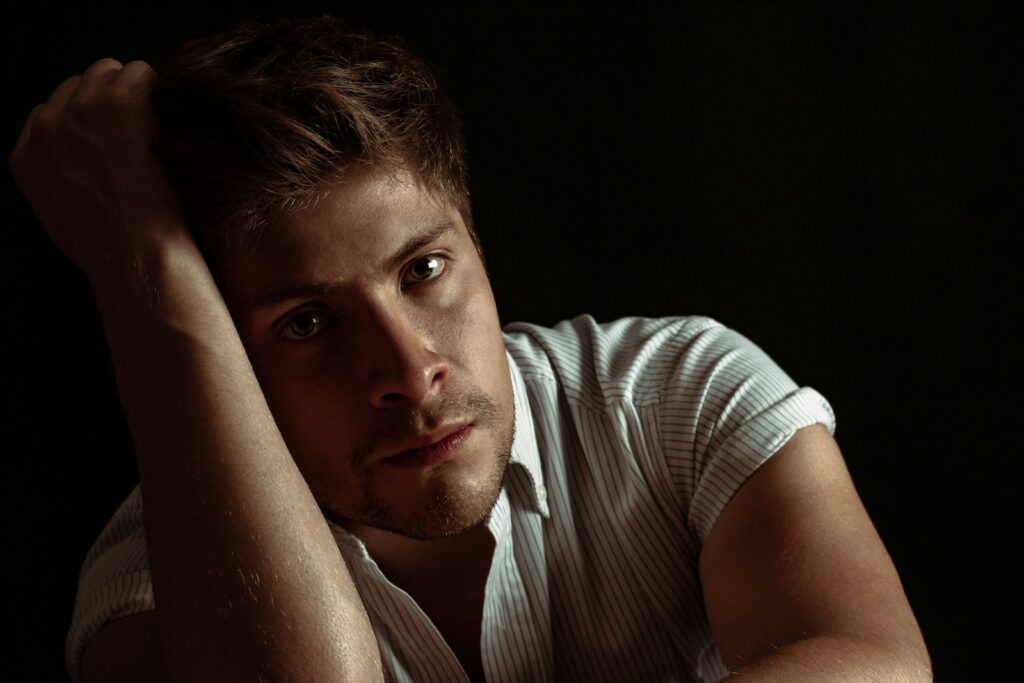man wearing white and gray striped shirt