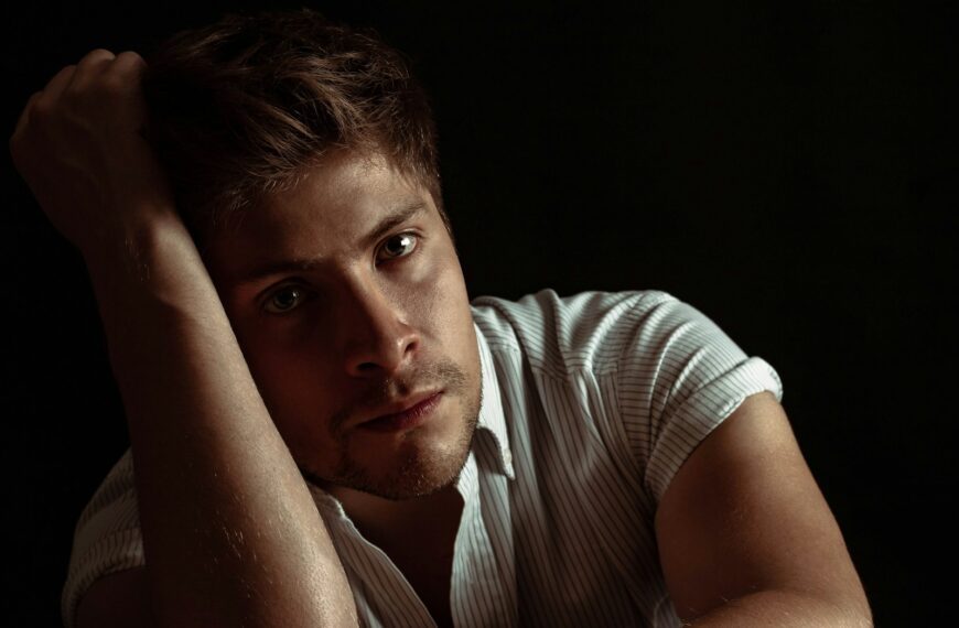 man wearing white and gray striped shirt