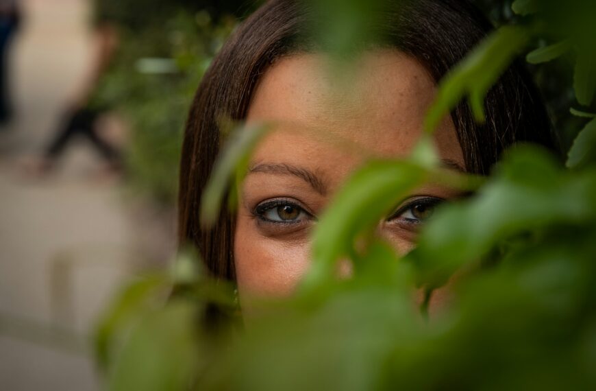 womans face on green leaves