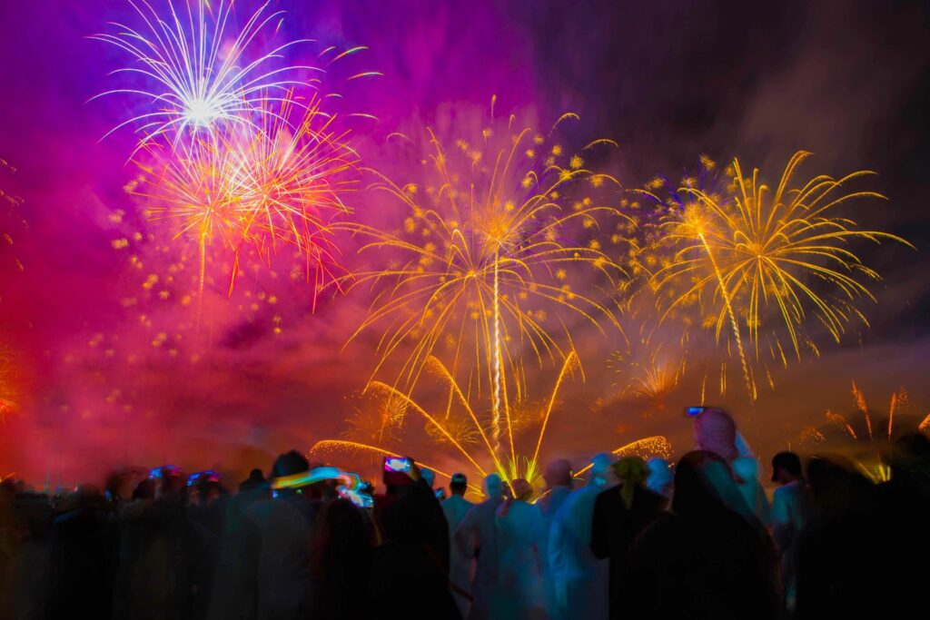 Spectacular fireworks light up the night sky in Ras Al-Khaimah, UAE during a festive celebration.