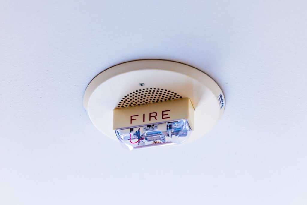 Close-up view of a ceiling-mounted fire alarm system ensuring safety in a building.
