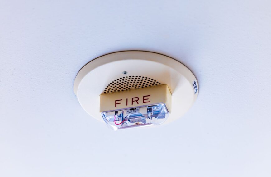 Close-up view of a ceiling-mounted fire alarm system ensuring safety in a building.