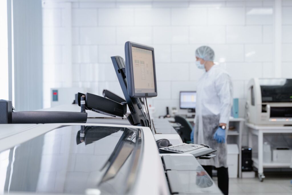Lab technician working in a modern research facility, focusing on technology and healthcare.