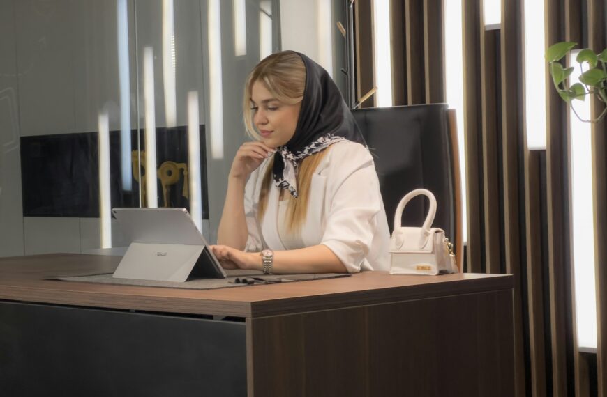 a woman sitting at a desk