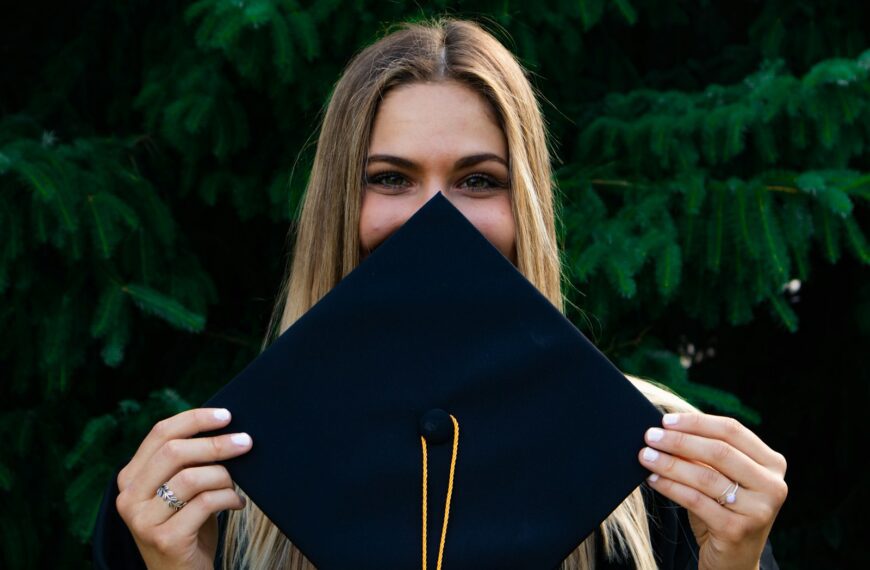woman covering her face with blue paper