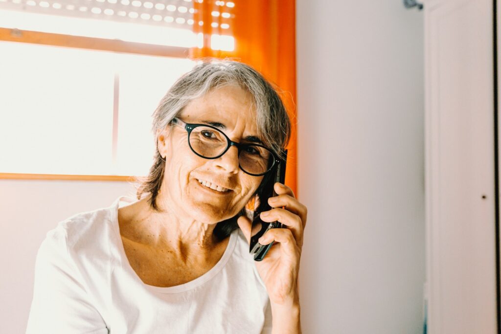 woman in white scoop neck shirt wearing black framed eyeglasses
