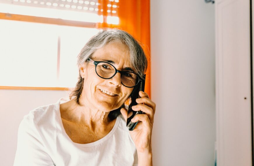 woman in white scoop neck shirt wearing black framed eyeglasses