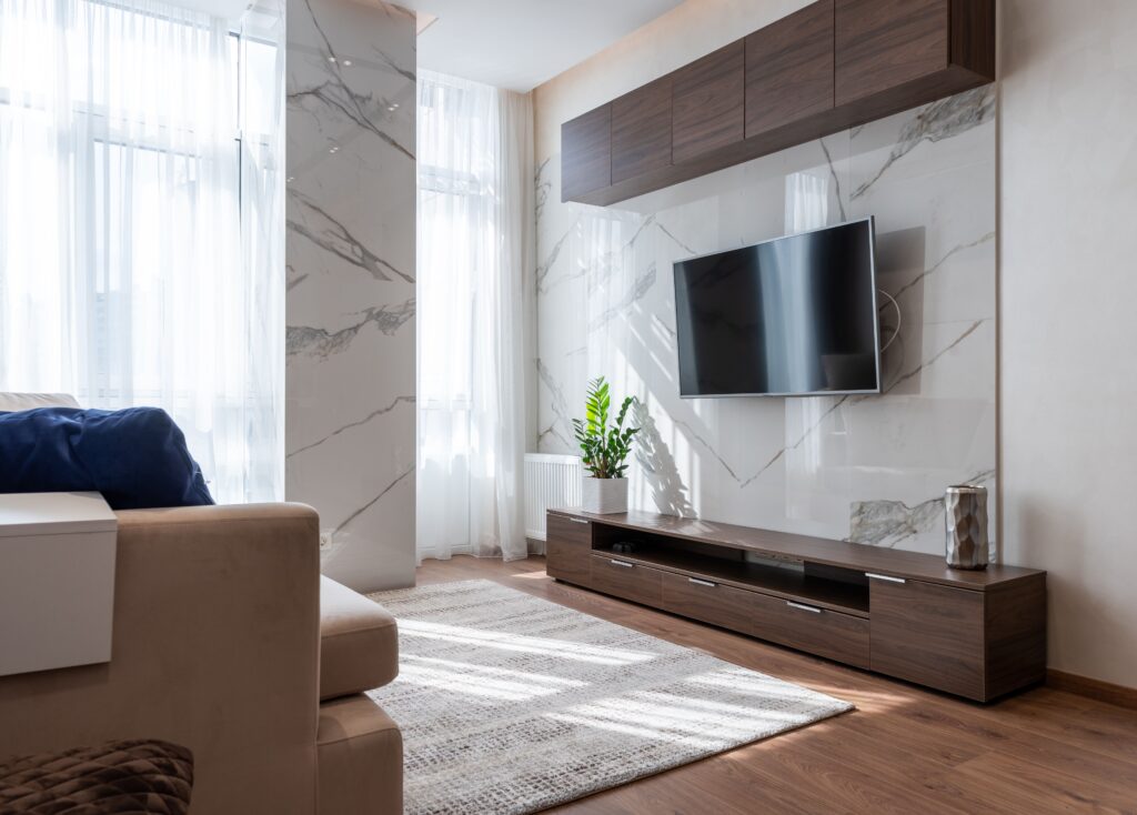 Cozy modern living room featuring wooden furniture and a comfortable couch