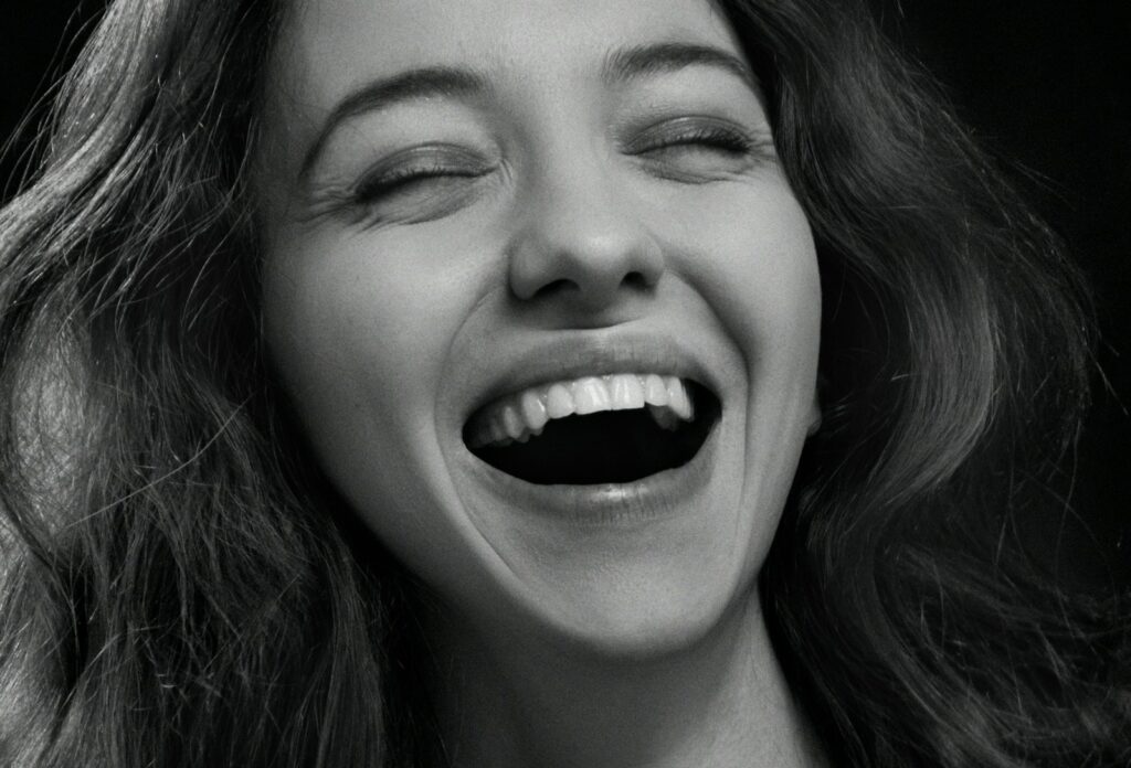 a woman with her eyes closed