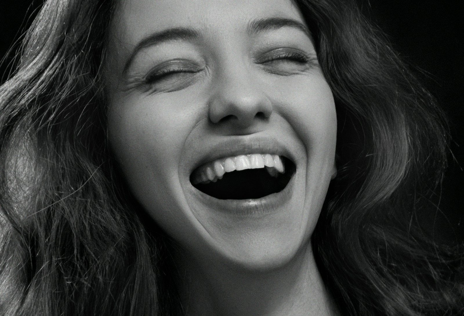 a woman with her eyes closed
