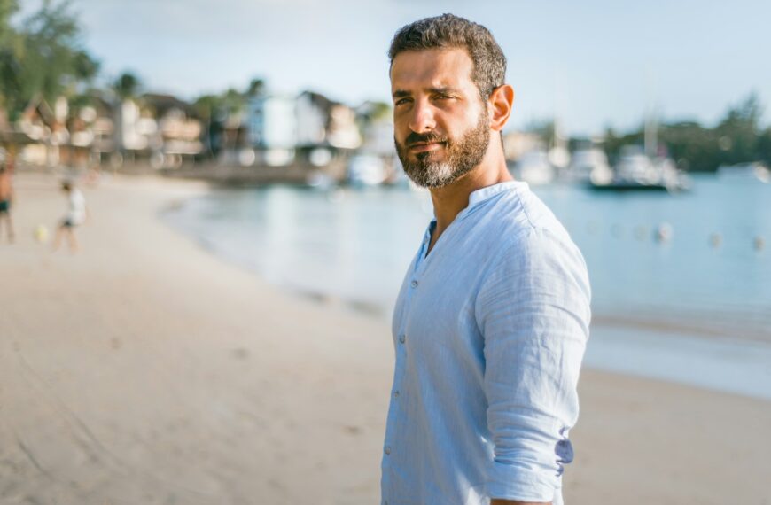 man standing on beach during daytime