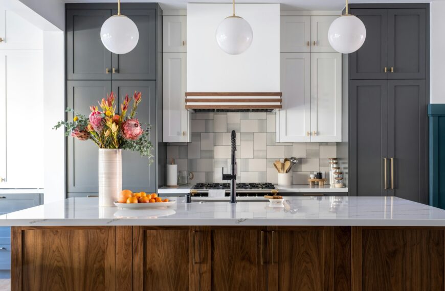 Bright renovated kitchen with white marble countertop and modern fixtures