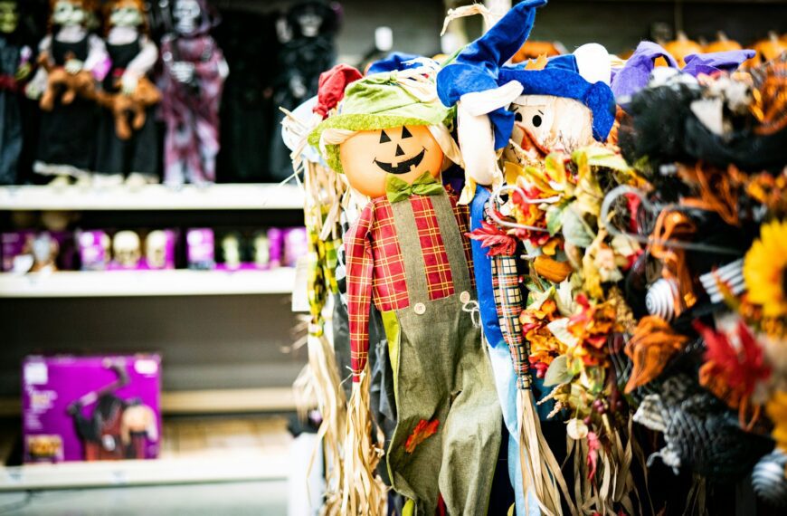 a display of scarecrows and pumpkins in a store