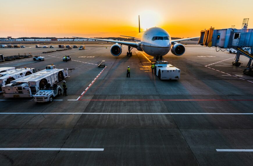 gray airplane on parking
