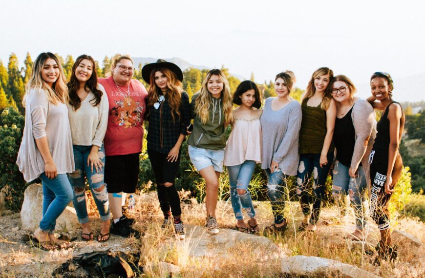 group of women standing on rock fragment