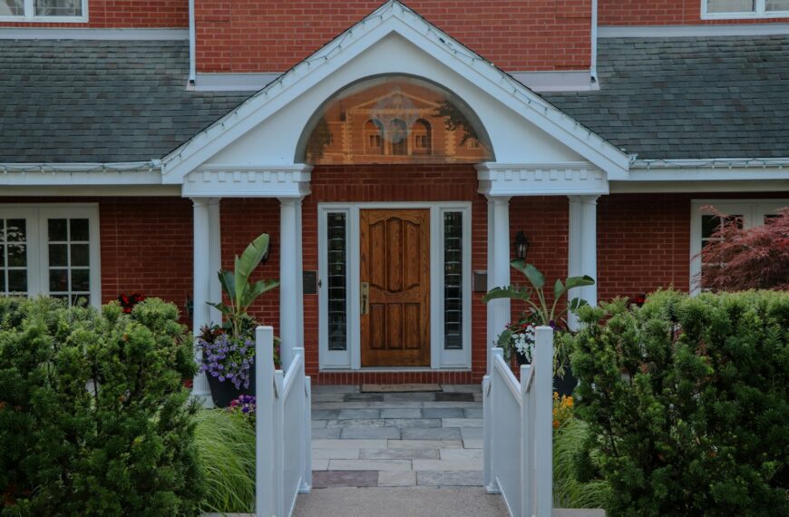 Elegant front entrance of a red brick house