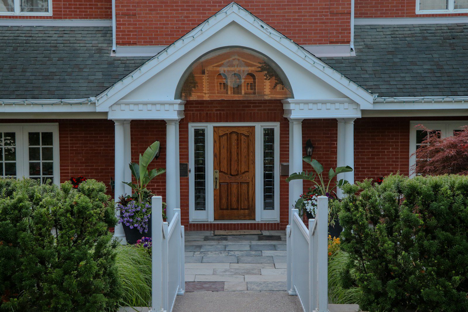 Elegant front entrance of a red brick house