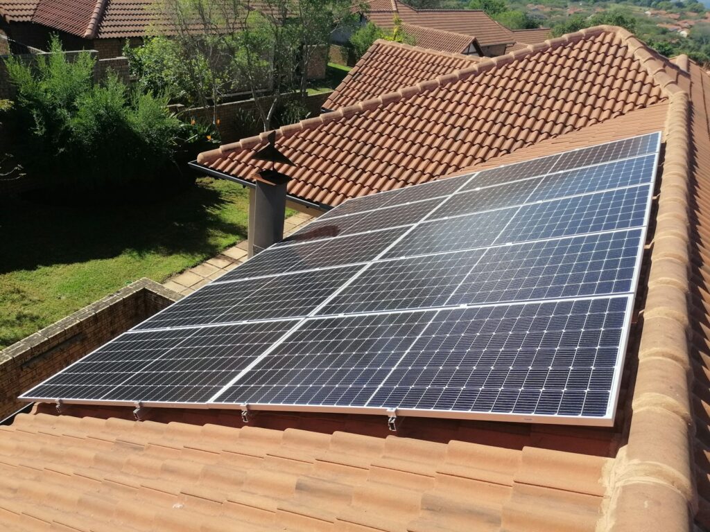 Solar panels on a red tile roof