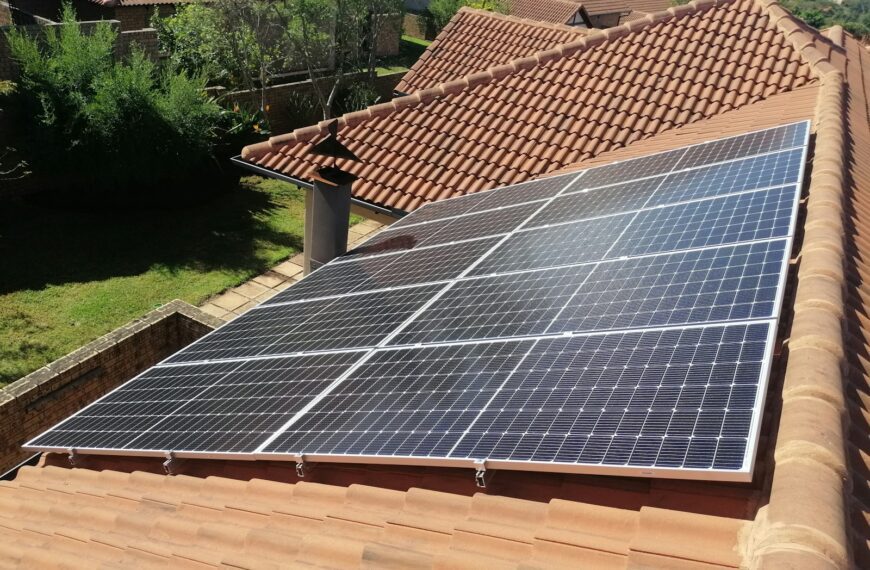 Solar panels on a red tile roof