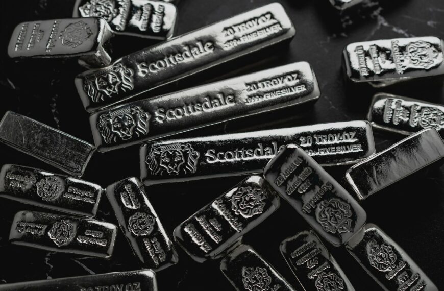 a pile of silver bars sitting on top of a table