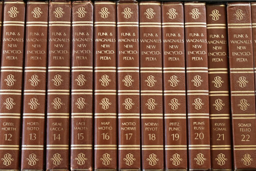 A row of vintage funk & wagnalls new encyclopedia volumes