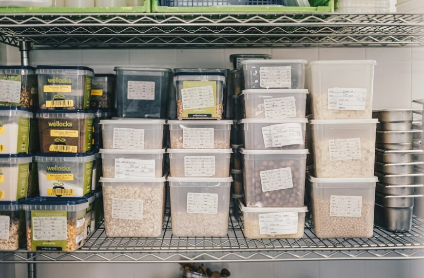 a shelf filled with containers and containers of food