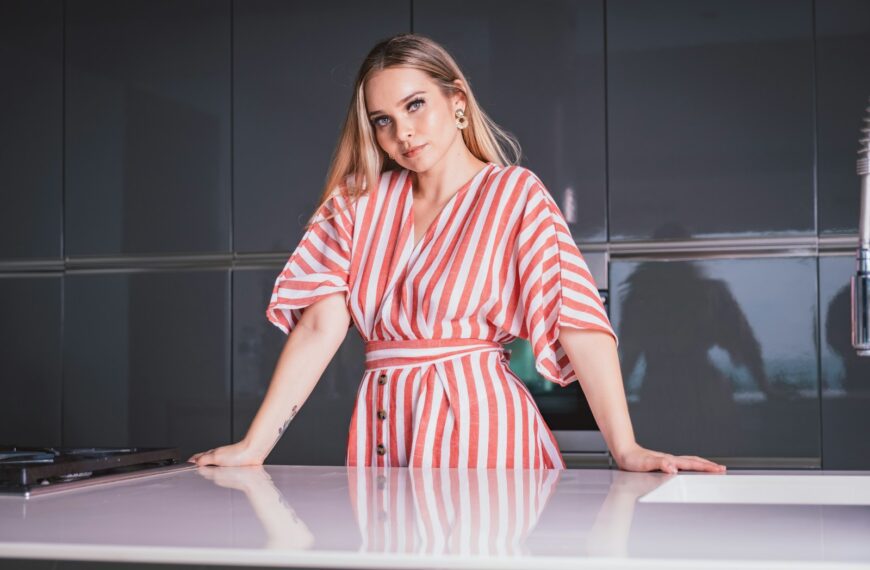 woman in red and white stripe dress