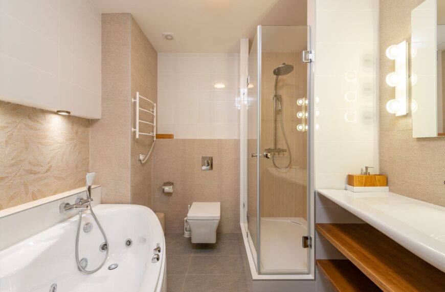 Contemporary bathroom featuring bathtub, shower, and elegant interior design elements.