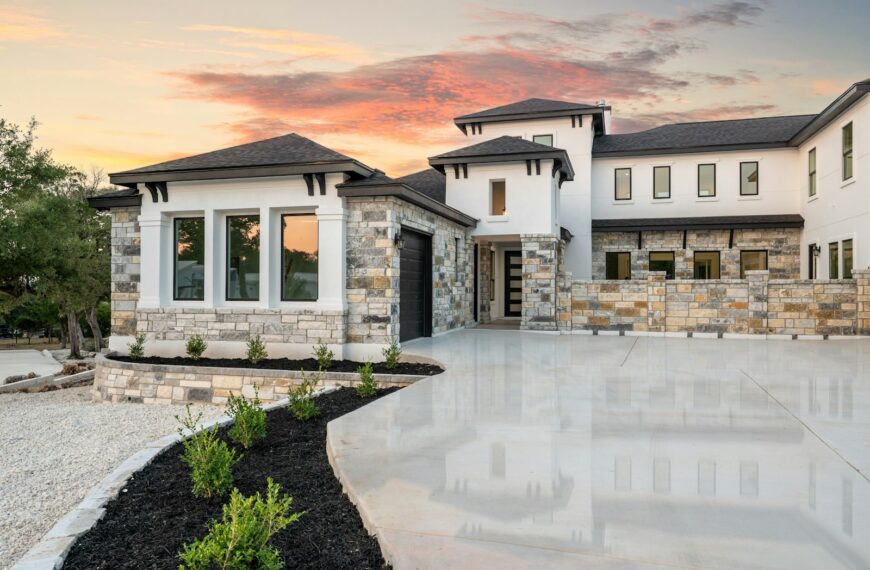 Modern luxury house with stone accents at sunset