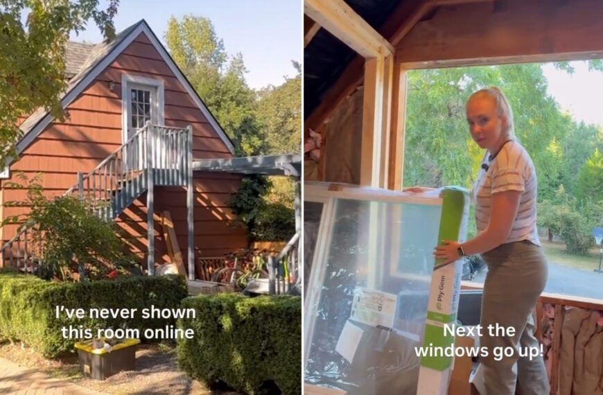 Exterior of the 96-year-old garage with its outdoor staircase, beside the homeowner holding a new window in the loft