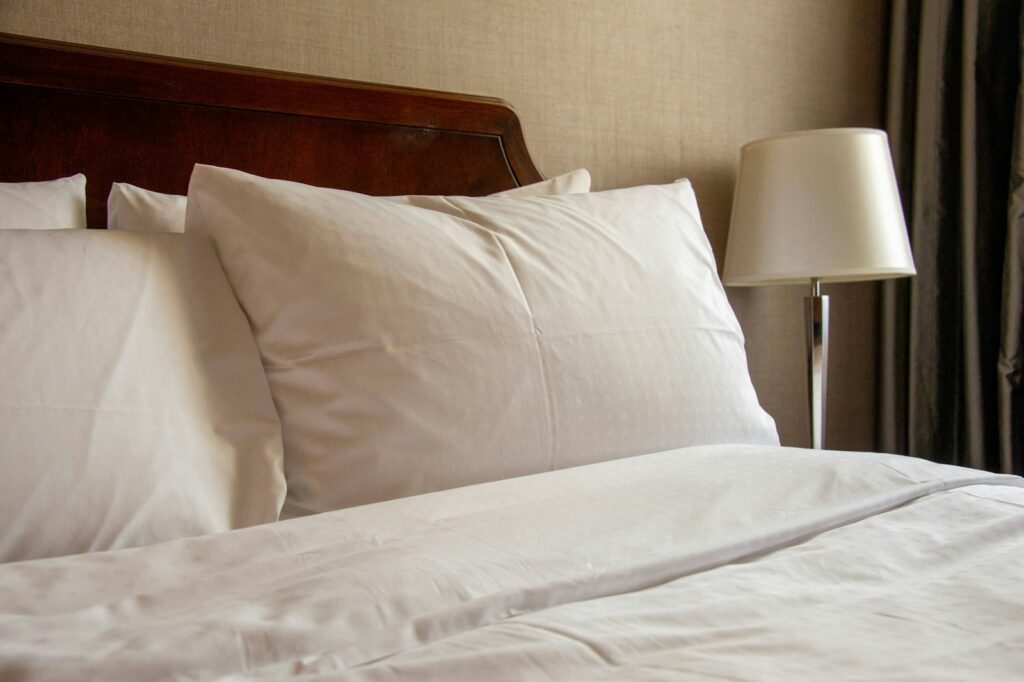 a bed with a lamp on it