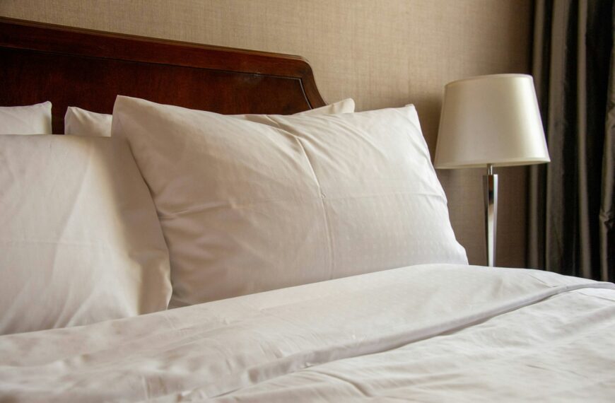 a bed with a lamp on it