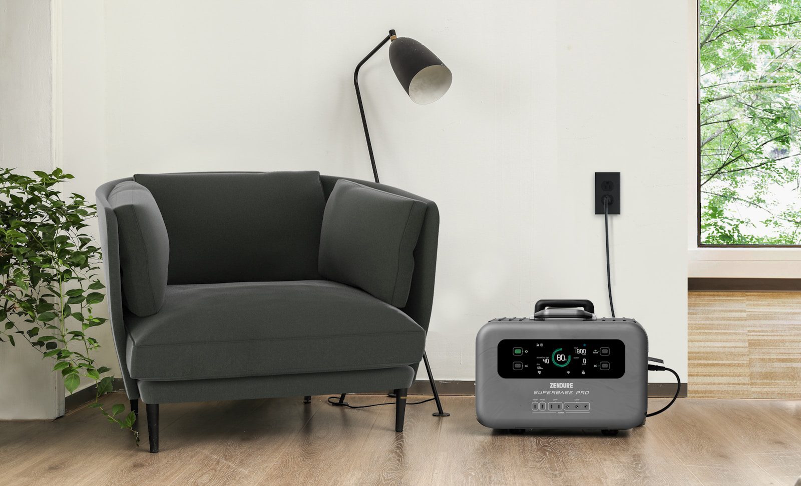 a grey chair sitting next to a black and white radio