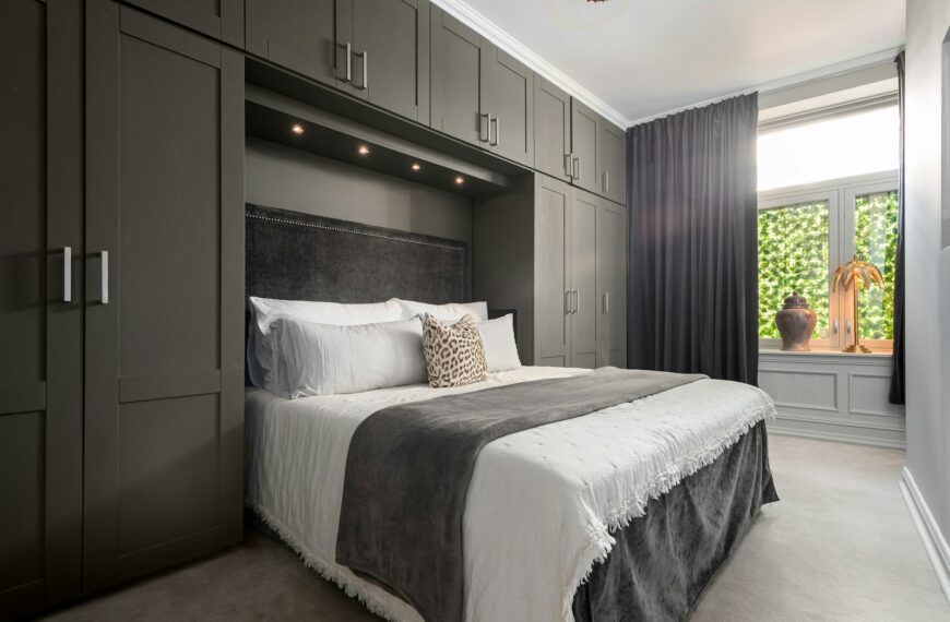 A bedroom with a bed and a closet