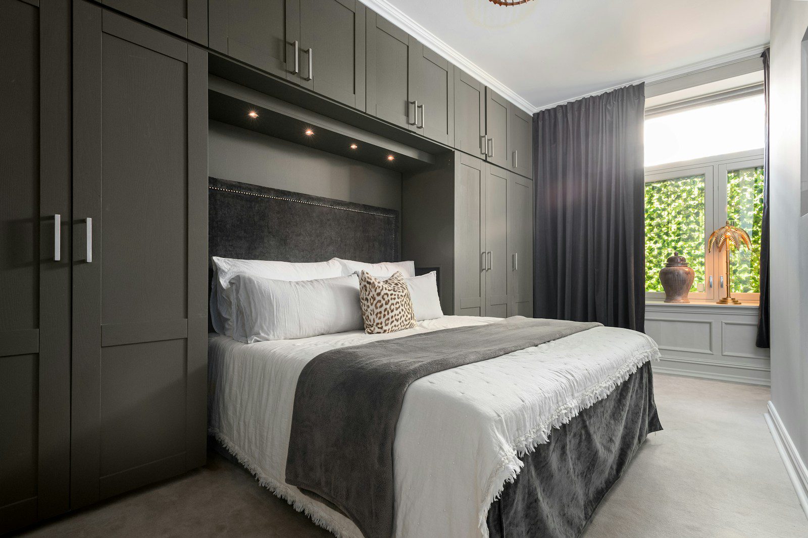 A bedroom with a bed and a closet