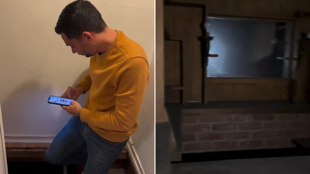 A man stepping down through a floor hatch, next to the brick-walled hidden speakeasy room beneath the house, from the creator's own Instagram reel