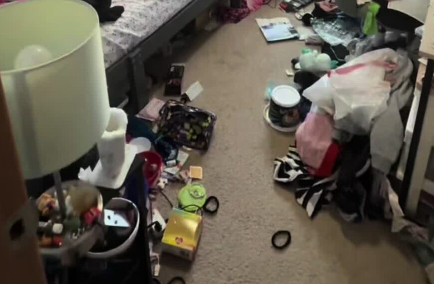 A cluttered kid's bedroom floor before a professional organizer's multi-day declutter, from the organizer's own TikTok video