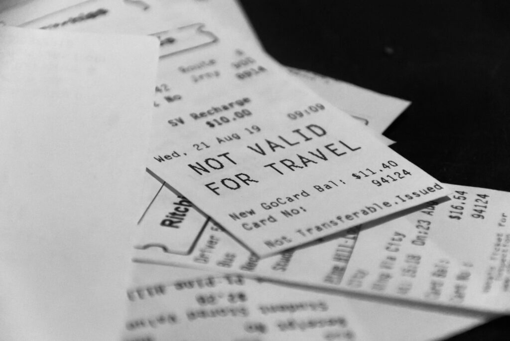 Pile of receipts, one says not valid for travel