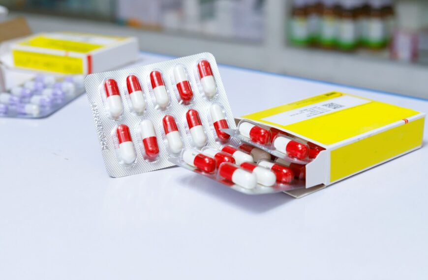 white and red medication pill blister pack