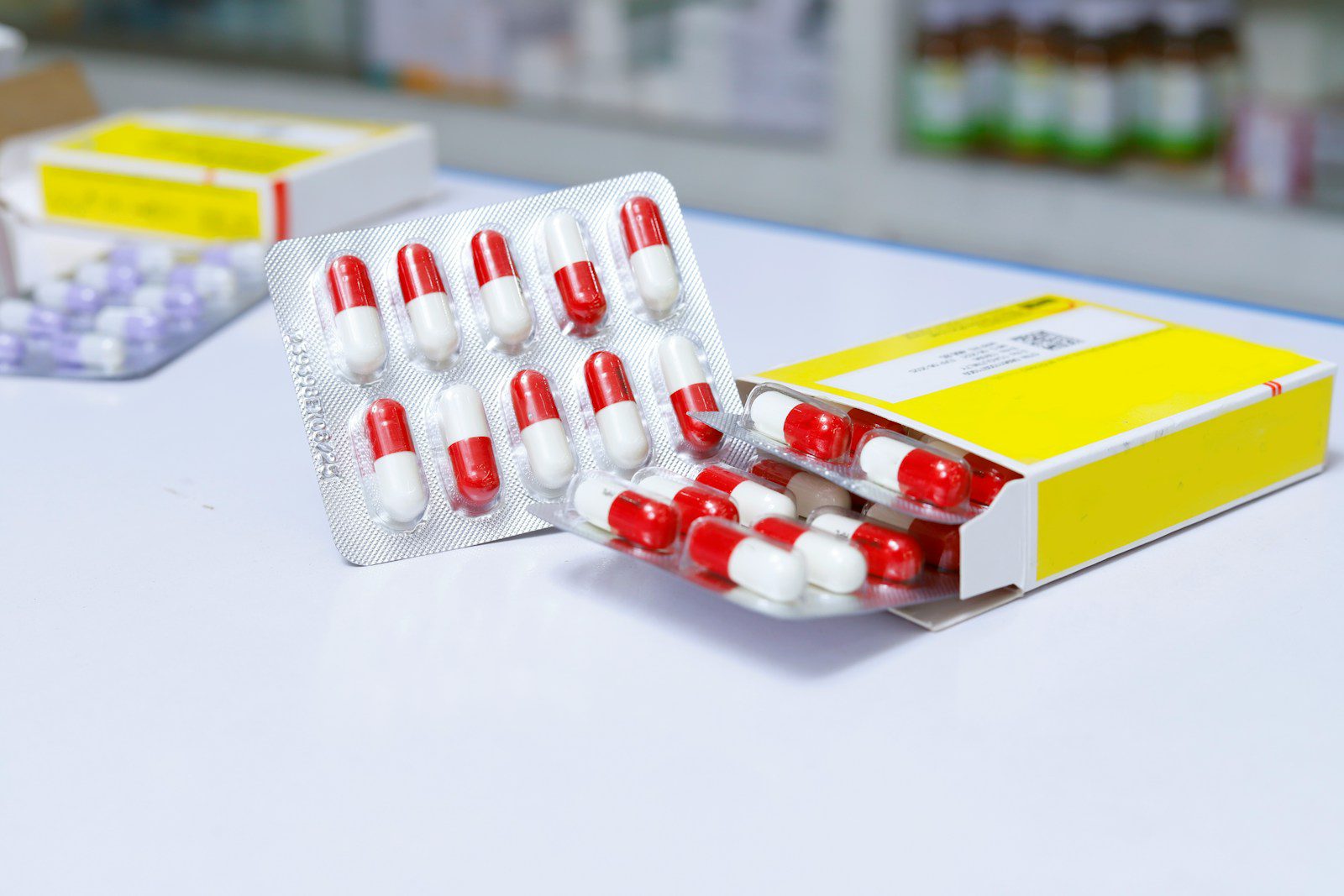 white and red medication pill blister pack