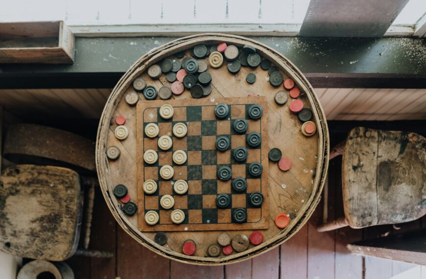 A wooden board game set up on a wall