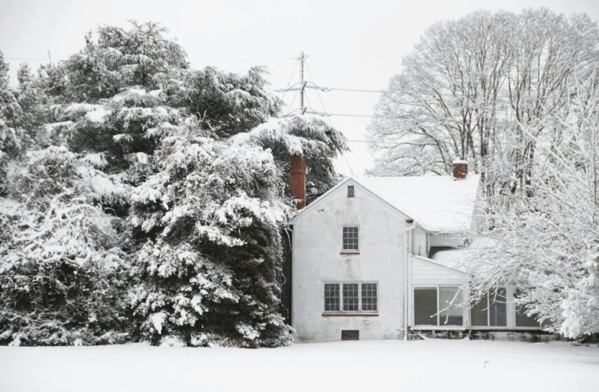 A white house covered in snow during winter