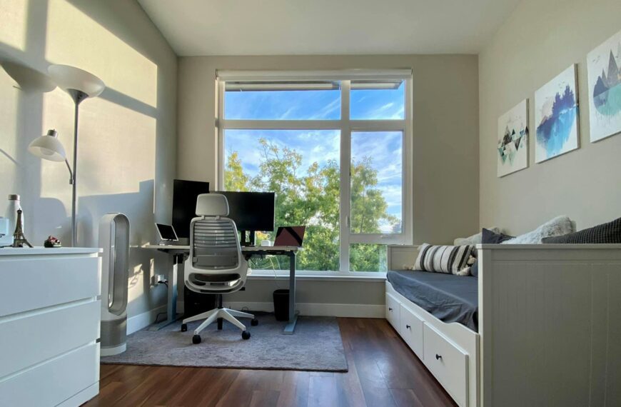 a bedroom with a desk and a chair