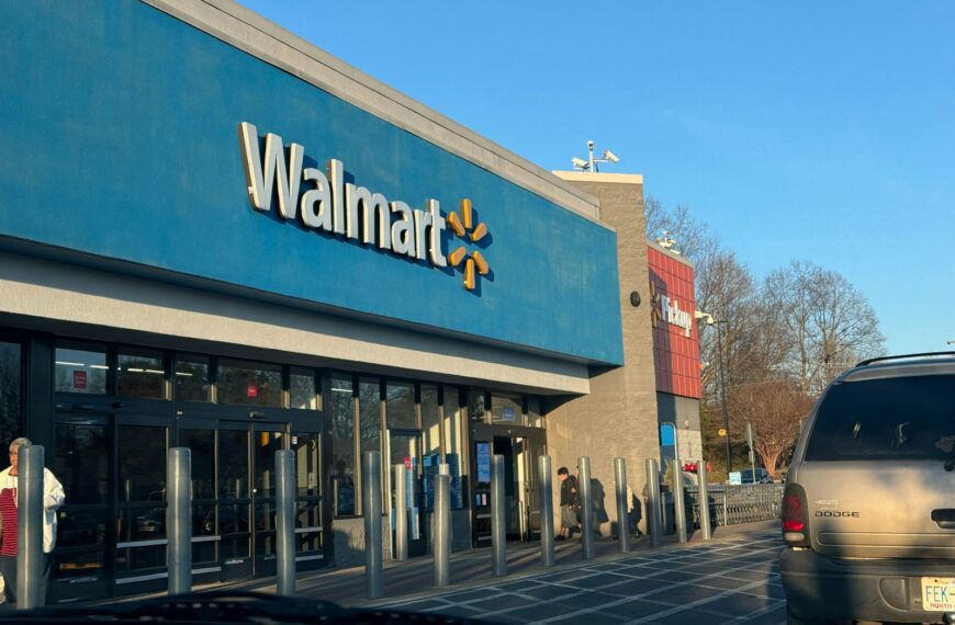 a walmart store with a car parked in front of it