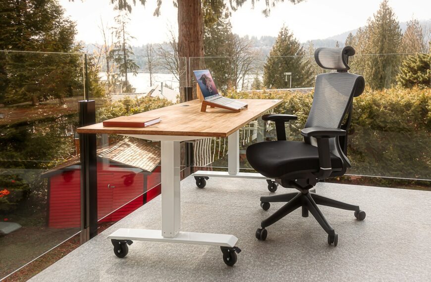 a desk with a laptop on top of it