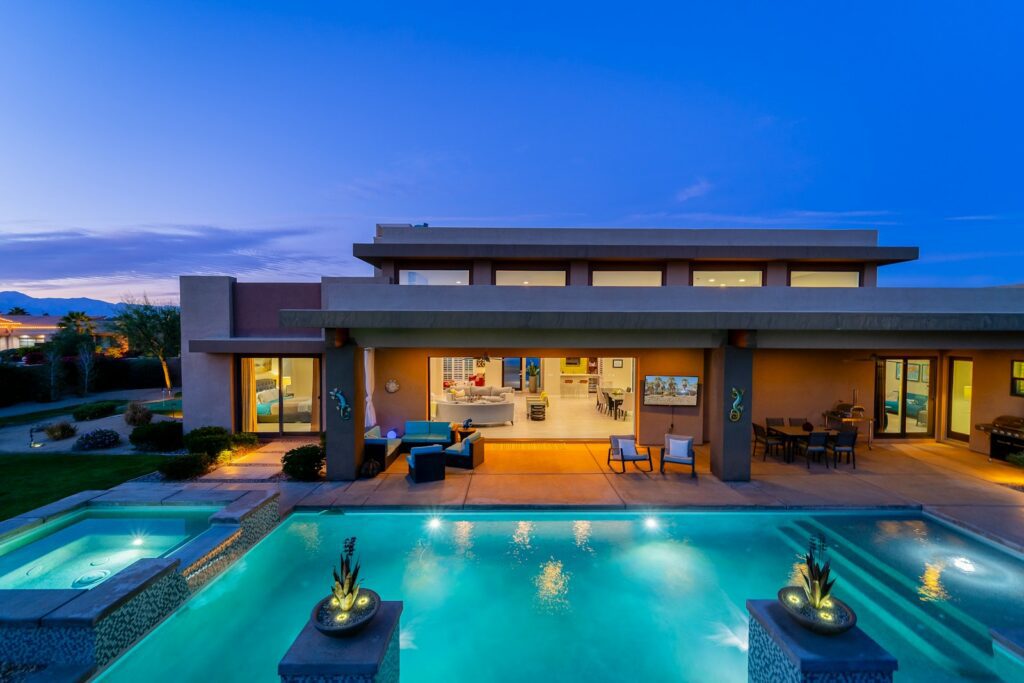 a house with a swimming pool in the middle of it