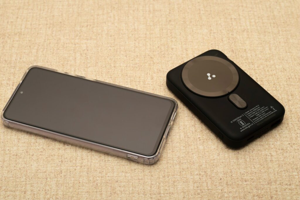 Smartphone and wireless charger on textured surface
