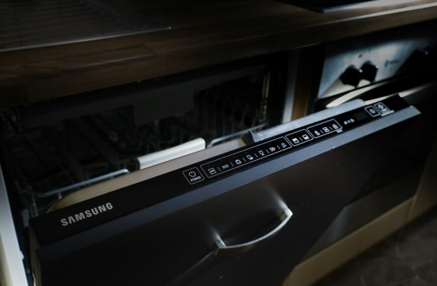 A modern samsung dishwasher drawer built into cabinetry